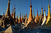 Inle Lake Myanmar. Indein, on the summit of a hill the  Shwe Inn Thein Paya a cluster of hundreds of ancient stupas. Many of them are ruined and overgrown with bushes. 